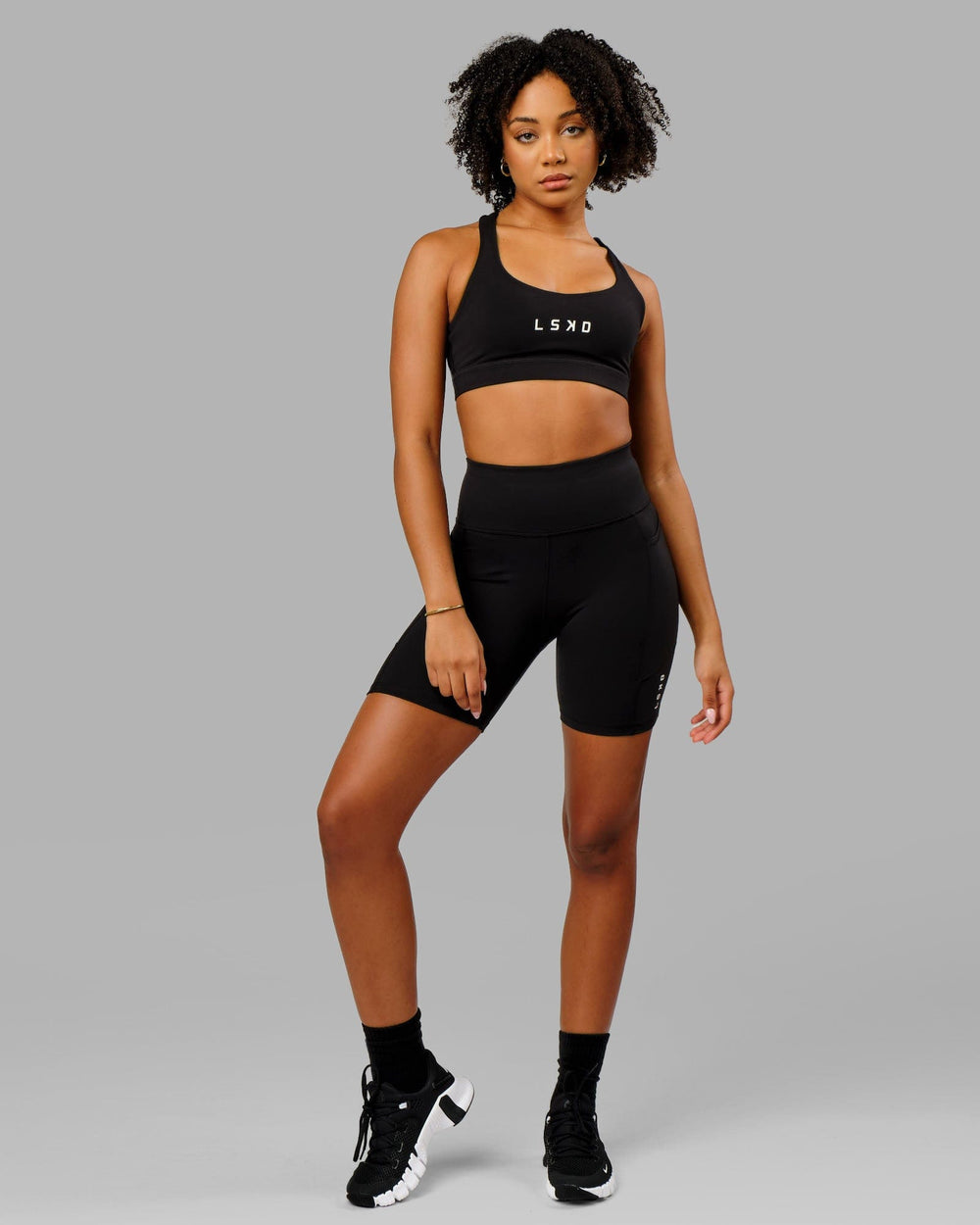 Woman wearing Rep Mid Short Tight Small Logo - Black