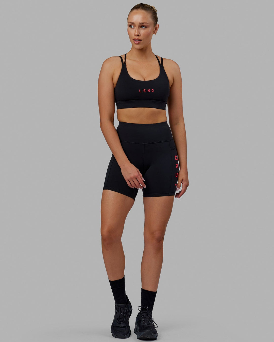 Woman wearing Rep Mid Short Tights - Black-Raspberry