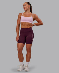 Woman wearing Rep Ultra High-Rise 6" Short Pockets - Cherry Lacquer-Marshmallow | Model:Amber | Size:S