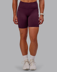 Woman wearing Rep Ultra High-Rise 6" Short Pockets - Cherry Lacquer-Marshmallow | Model:Amber | Size:S