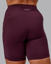 Woman wearing Rep Ultra High-Rise 6" Short Pockets - Cherry Lacquer-Marshmallow | Model:Amber | Size:S