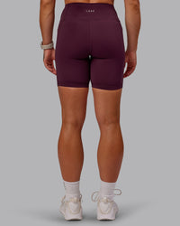Woman wearing Rep Ultra High-Rise 6" Short Pockets - Cherry Lacquer-Marshmallow | Model:Amber | Size:S