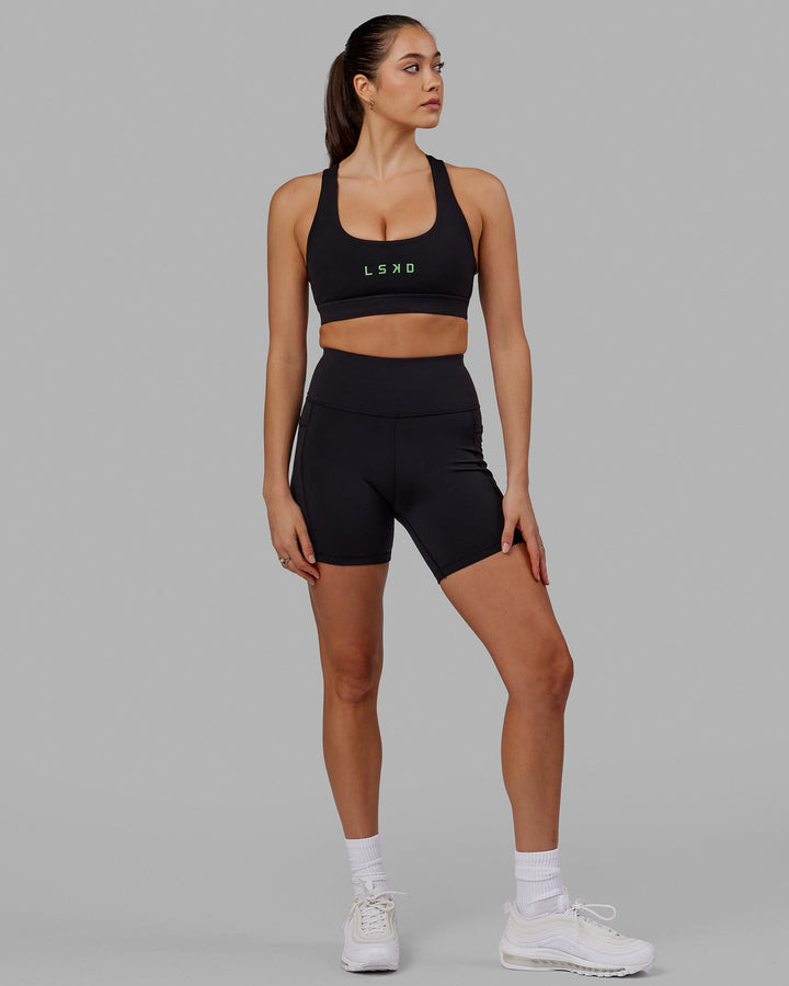 Woman wearing Rep Sports Bra Small Logo - Black-Apple Mint