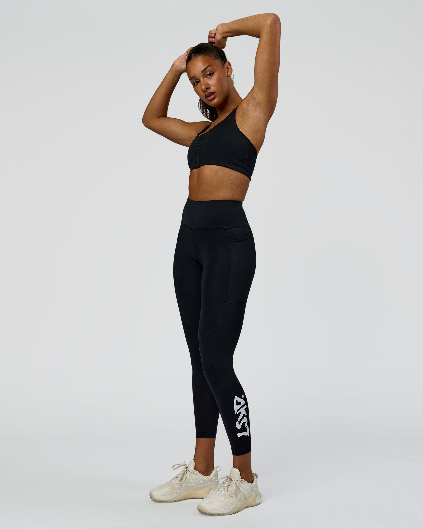 Woman wearing Rep Street Script Ultra High-Rise 7/8 Legging Pockets - Black-White | Model:Rosie | Size:S
