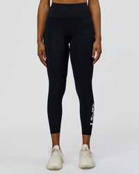 Woman wearing Rep Street Script Ultra High-Rise 7/8 Legging Pockets - Black-White | Model:Rosie | Size:S