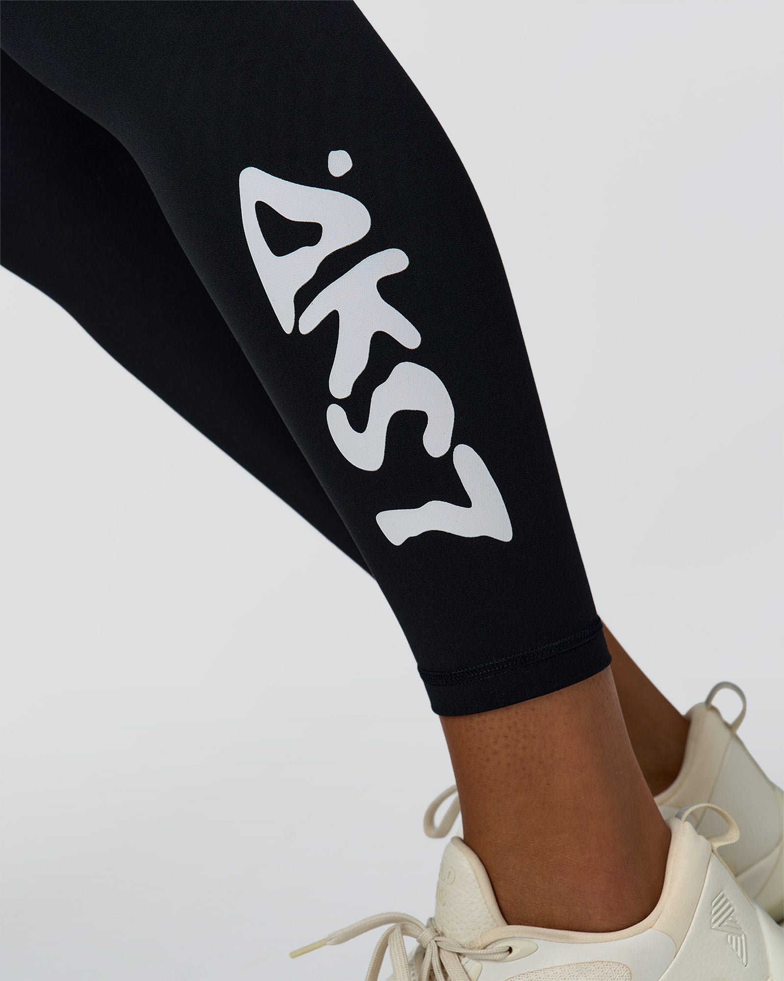Woman wearing Rep Street Script Ultra High-Rise Full Length Legging Pockets - Black-White | Model:Rosie | Size:S