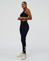 Woman wearing Rep Street Script Ultra High-Rise Full Length Legging Pockets - Black-White | Model:Rosie | Size:S