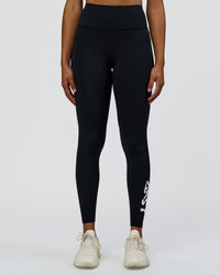 Woman wearing Rep Street Script Ultra High-Rise Full Length Legging Pockets - Black-White | Model:Rosie | Size:S