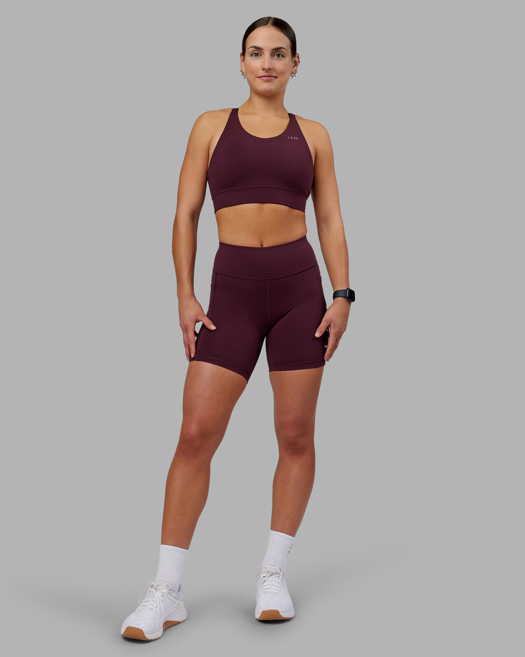 Woman wearing Rep Ultra High-Rise 6" Short Pockets - Cherry Lacquer-White | Model:Keisha | Size:S