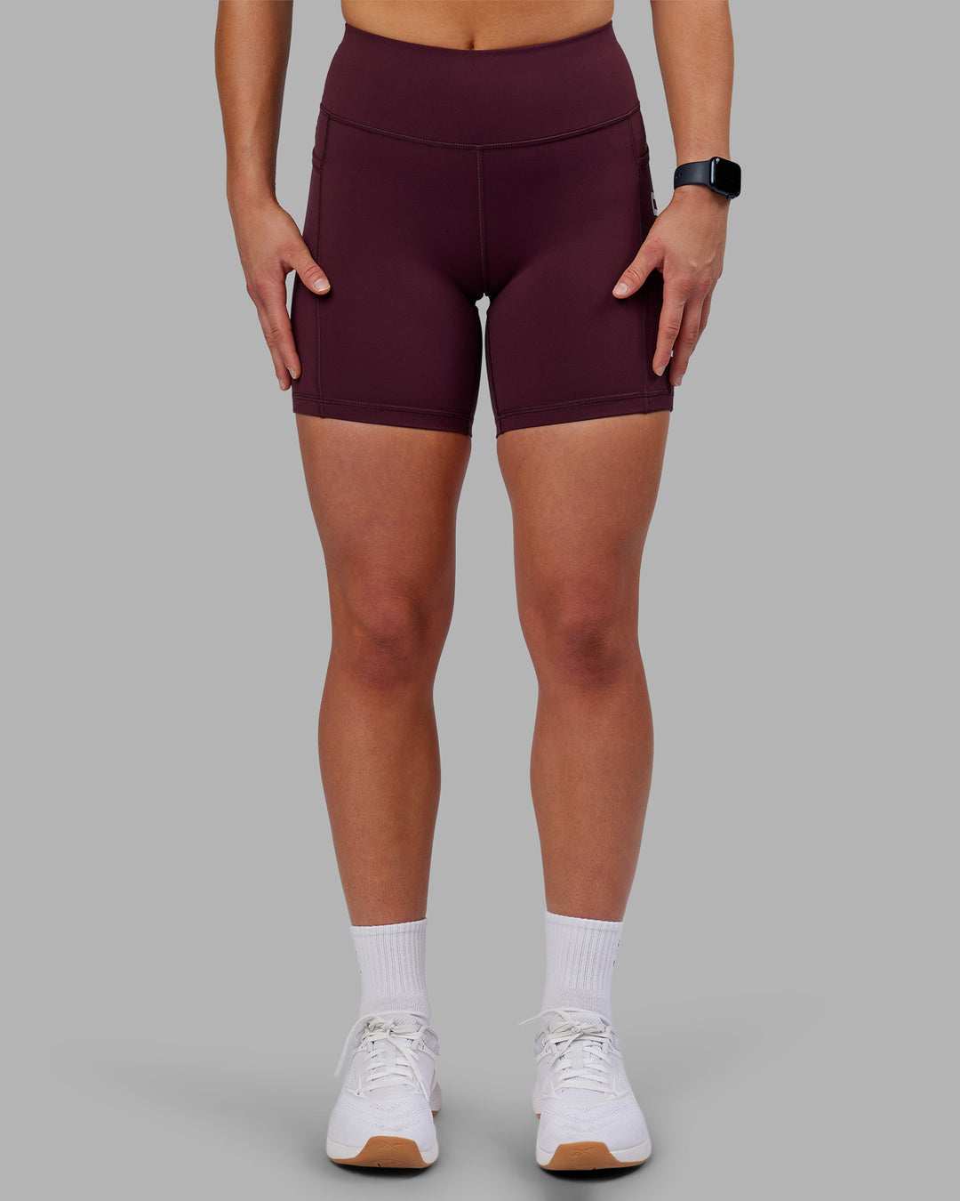 Woman wearing Rep Ultra High-Rise 6" Short Pockets - Cherry Lacquer-White | Model:Keisha | Size:S