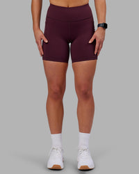 Woman wearing Rep Ultra High-Rise 6" Short Pockets - Cherry Lacquer-White | Model:Keisha | Size:S