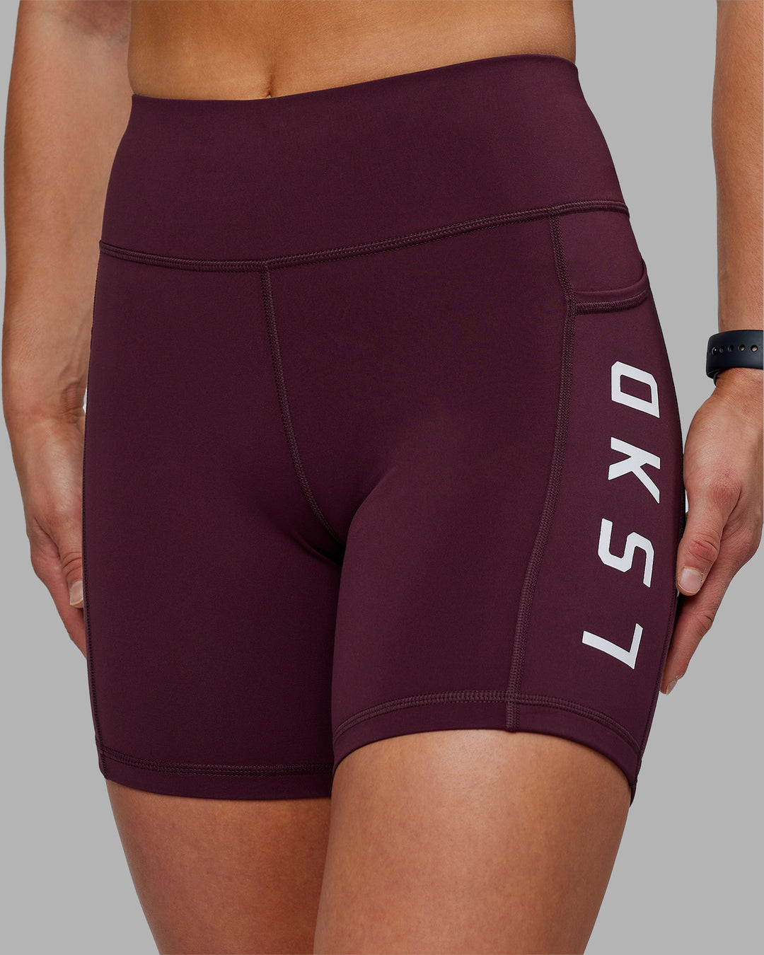 Woman wearing Rep Ultra High-Rise 6" Short Pockets - Cherry Lacquer-White | Model:Keisha | Size:S