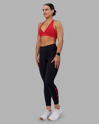 Woman wearing Rep Ultra High-Rise 7/8 Legging Pockets - Black-Scarlet | Model:Keisha | Size:S