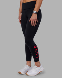 Woman wearing Rep Ultra High-Rise 7/8 Legging Pockets - Black-Scarlet | Model:Keisha | Size:S