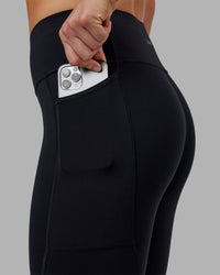 Woman wearing Rep Ultra High-Rise 7/8 Legging Pockets - Black-Scarlet | Model:Keisha | Size:S
