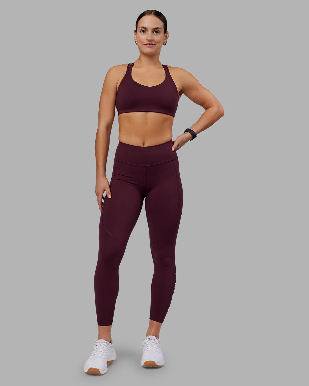 Woman wearing Rep Ultra High-Rise 7/8 Legging Pockets - Cherry Lacquer-White | Model:Keisha | Size:S