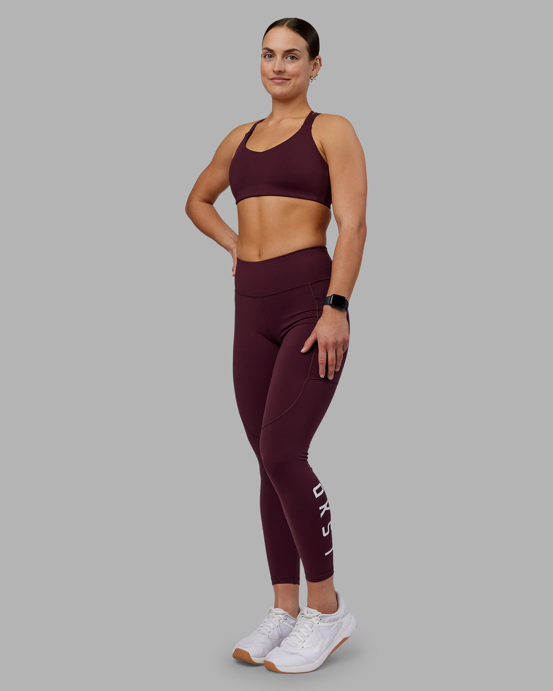 Woman wearing Rep Ultra High-Rise 7/8 Legging Pockets - Cherry Lacquer-White | Model:Keisha | Size:S