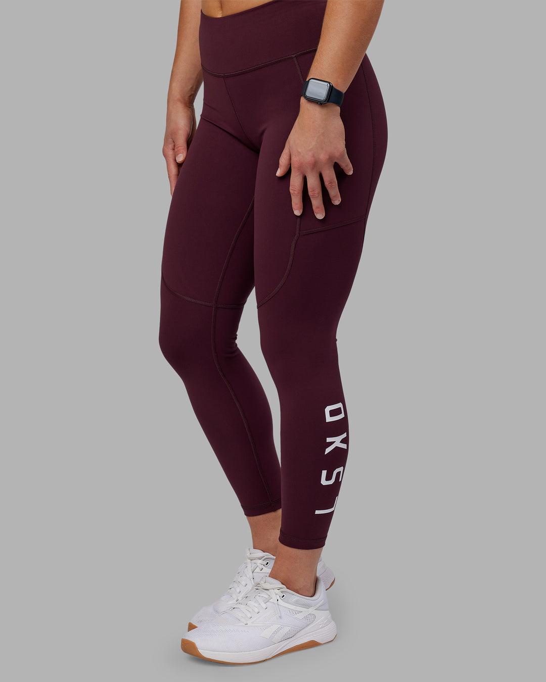 Woman wearing Rep Ultra High-Rise 7/8 Legging Pockets - Cherry Lacquer-White | Model:Keisha | Size:S
