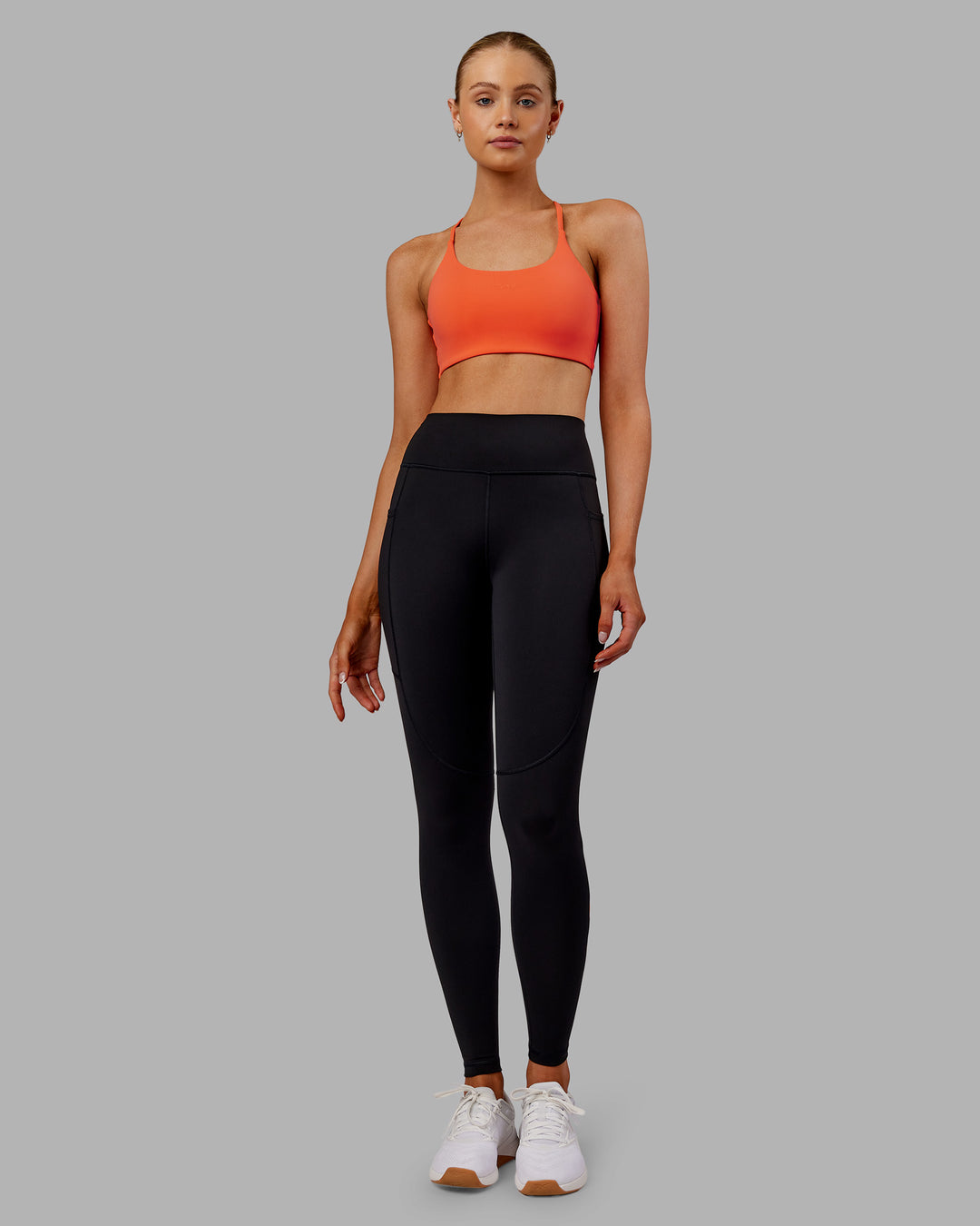Woman wearing Rep Ultra High-Rise Full Length Legging Pockets - Black-Ultra Orange | Model:Ella | Size:S