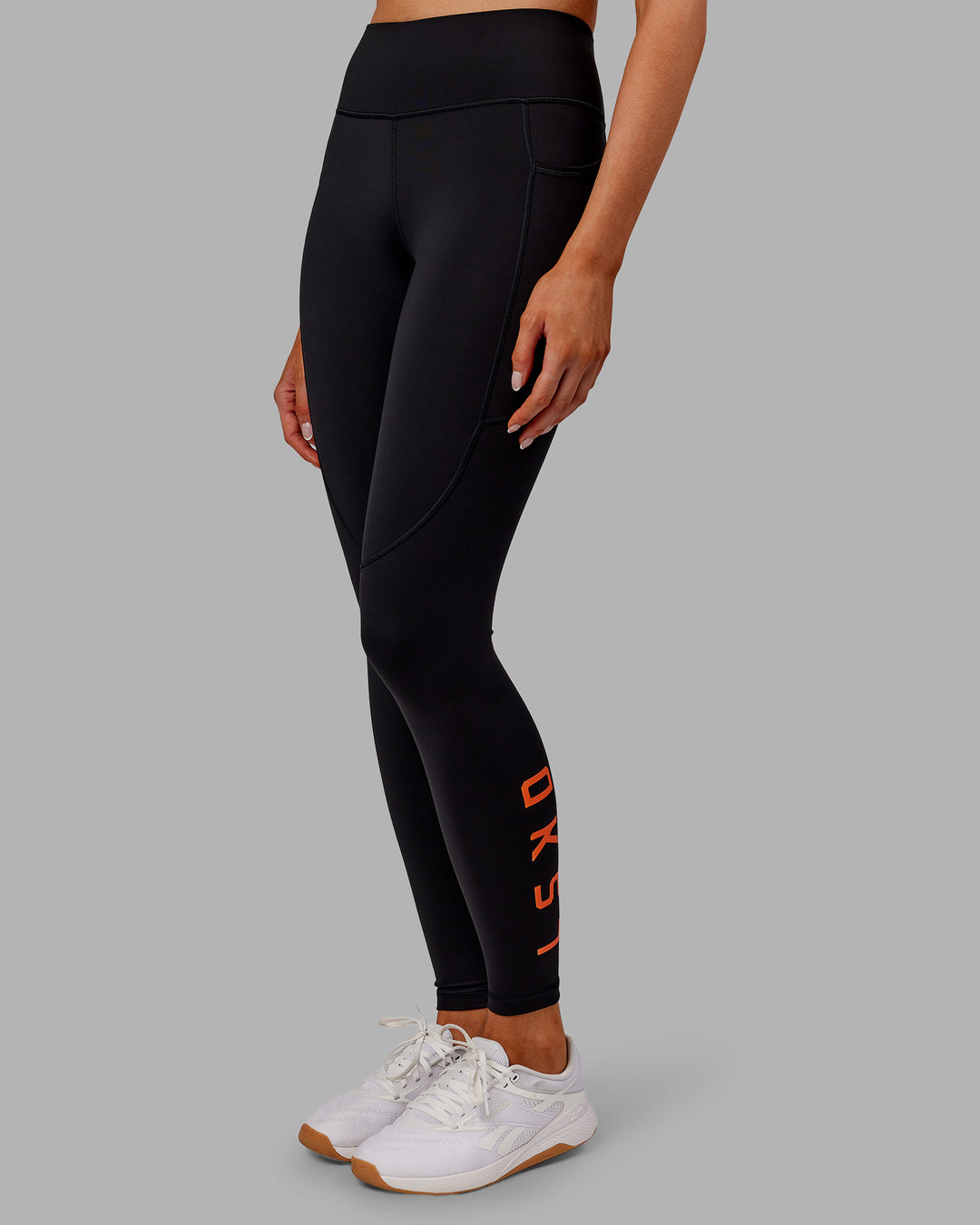Woman wearing Rep Ultra High-Rise Full Length Legging Pockets - Black-Ultra Orange | Model:Ella | Size:S