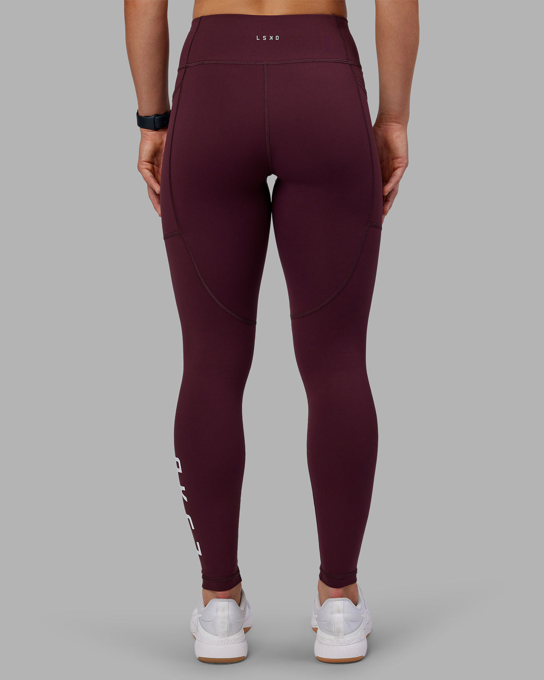 Woman wearing Rep Ultra High-Rise Full Length Legging Pockets - Cherry Lacquer-White | Model:Keisha | Size:S