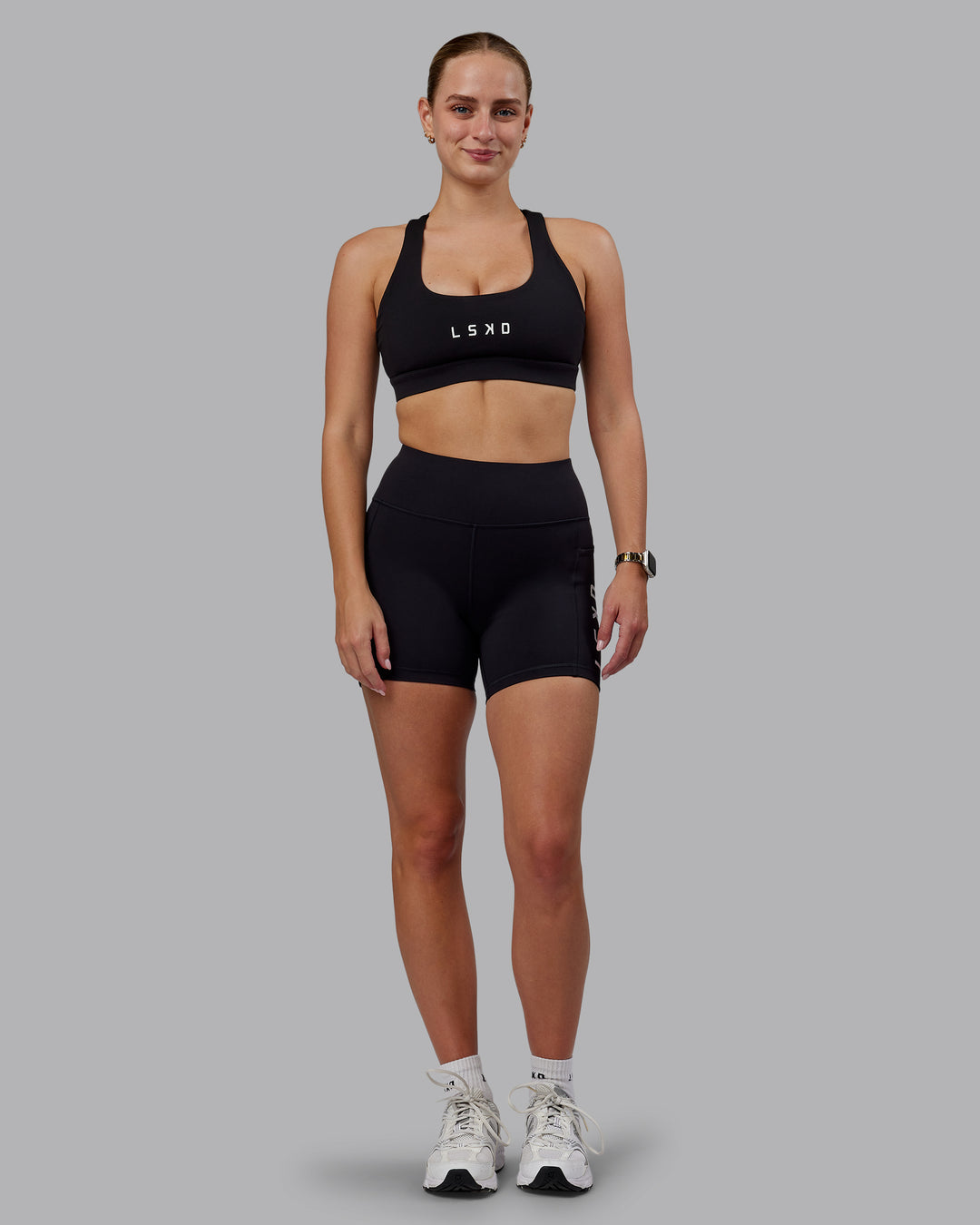 Woman wearing Rep Ultra High-Rise 4&quot; Short Pockets - Black-White | Model:Lillie | Size:S