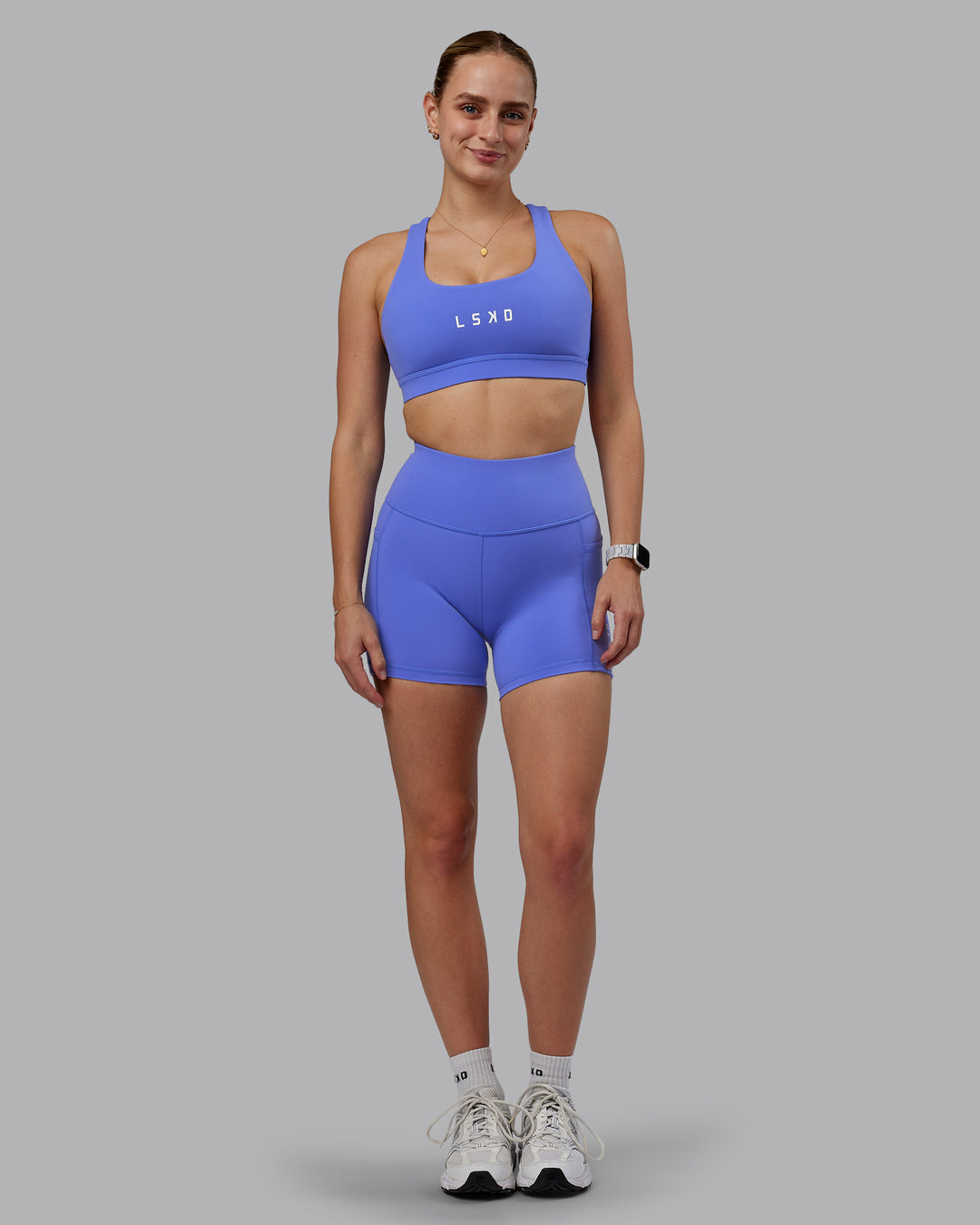 Woman wearing Rep Ultra High-Rise 4&quot; Short Pockets - Baja Blue-White | Model:Lillie | Size:S