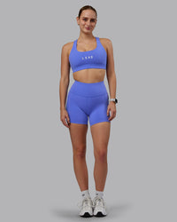 Woman wearing Rep Ultra High-Rise 4" Short Pockets - Baja Blue-White | Model:Lillie | Size:S