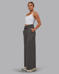Woman wearing Restore CloudFLX Wide Leg Pant - Dark Storm | Model:Paris | Size:S