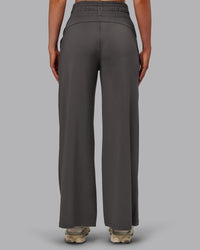 Woman wearing Restore CloudFLX Wide Leg Pant - Dark Storm | Model:Paris | Size:S