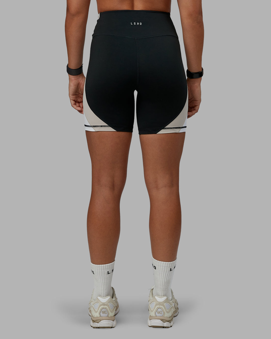 Woman wearing Revitalise Ultra High-Rise 6" Short - Black-Multi | Model:Tylah | Size:S