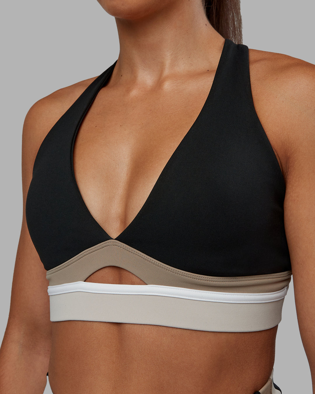 Woman wearing Revitalise Sports Bra - Black-Multi | Model:Tylah | Size:S