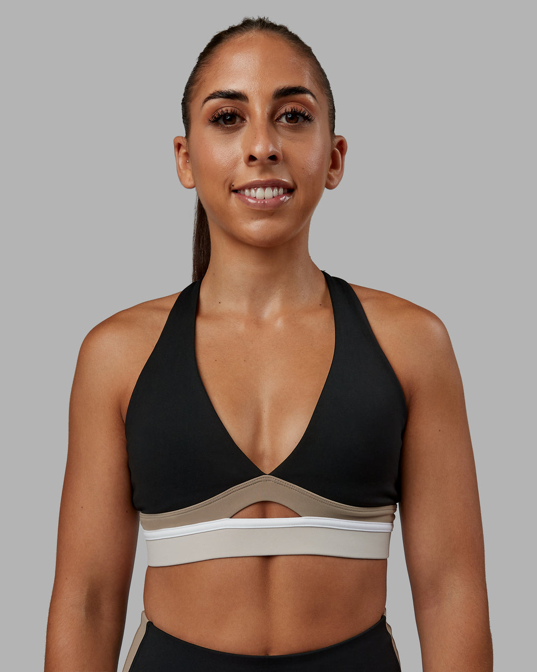 Woman wearing Revitalise Sports Bra - Black-Multi | Model:Tylah | Size:S