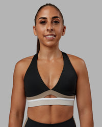 Woman wearing Revitalise Sports Bra - Black-Multi | Model:Tylah | Size:S
