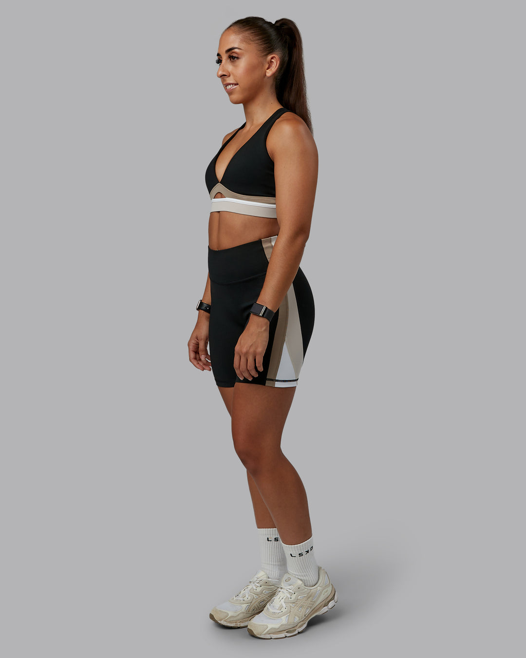 Woman wearing Revitalise Sports Bra - Black-Multi | Model:Tylah | Size:S