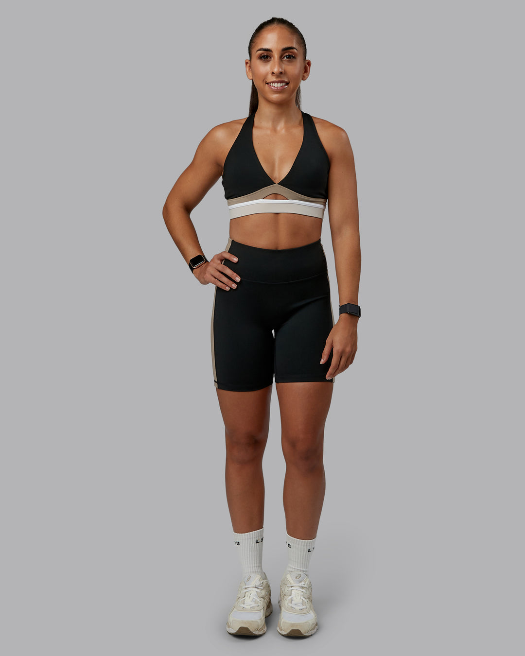 Woman wearing Revitalise Sports Bra - Black-Multi | Model:Tylah | Size:S