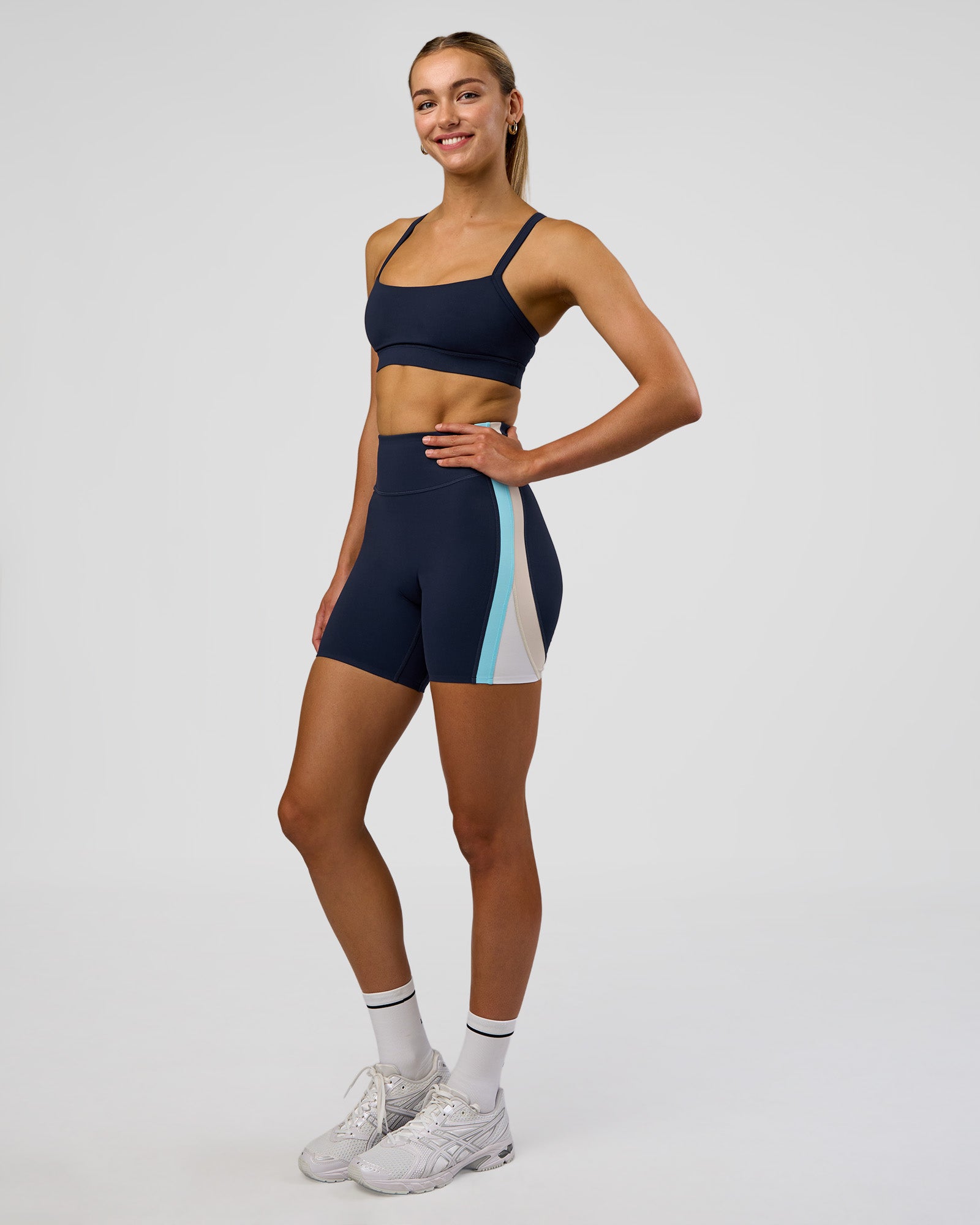 Woman wearing Revitalise Ultra High-Rise 6" Short - Future Navy-Multi | Model:Evie | Size:S