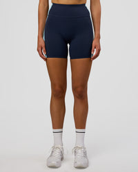 Woman wearing Revitalise Ultra High-Rise 6" Short - Future Navy-Multi | Model:Evie | Size:S