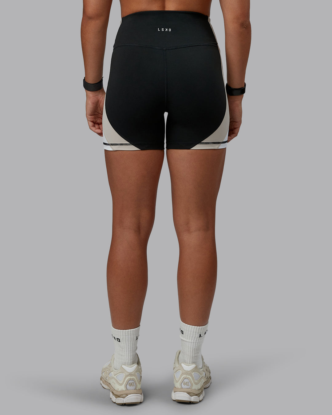 Woman wearing Revitalise Ultra High-Rise 4&quot; Short - Black-Multi | Model:Tylah | Size:S