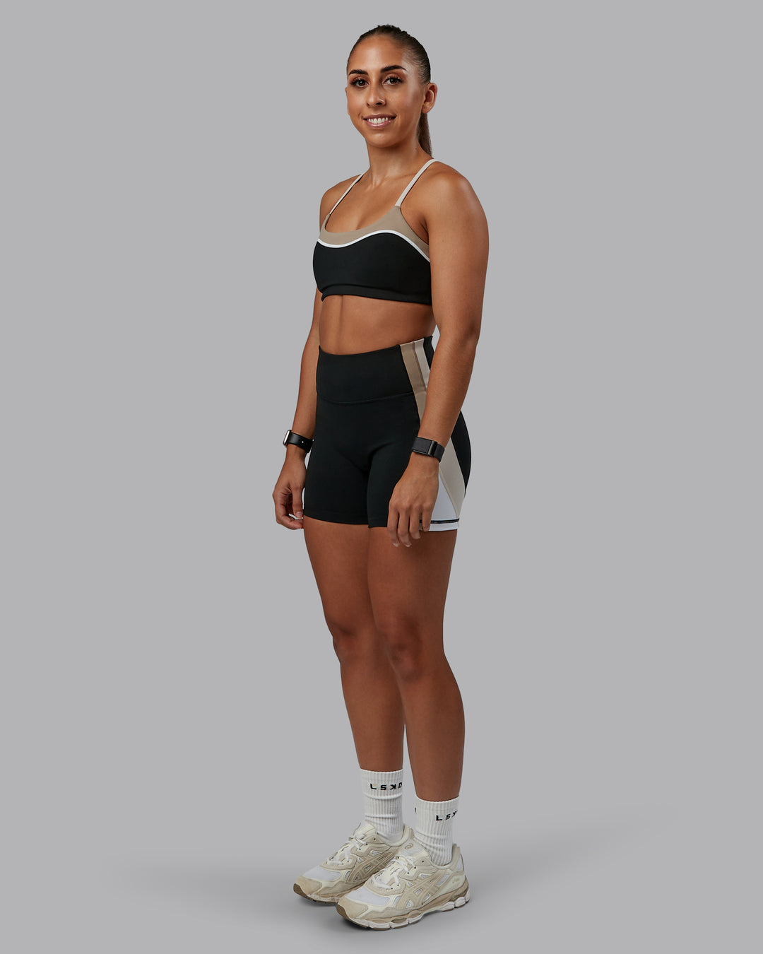 Woman wearing Revitalise Ultra High-Rise 4&quot; Short - Black-Multi | Model:Tylah | Size:S