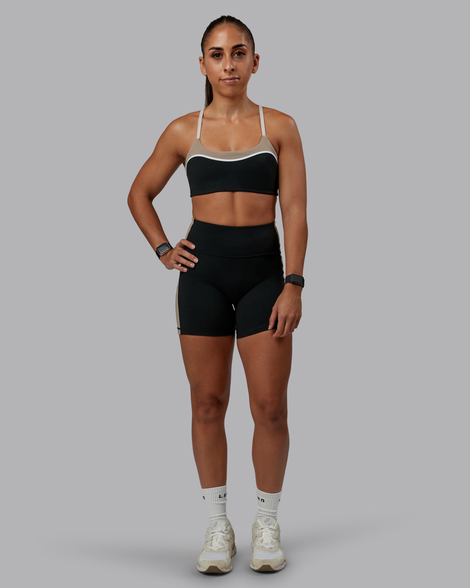 Woman wearing Revitalise Ultra High-Rise 4" Short - Black-Multi | Model:Tylah | Size:S