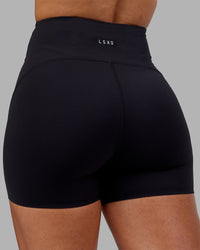 Woman wearing Rhythm Elixir Ultra High-Rise 4" Short - Black | Model:Ayla | Size:S | Thumbnail Index: 7