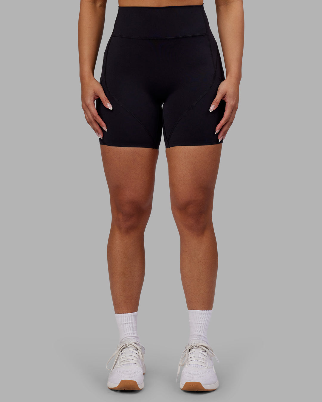 Woman wearing Rhythm Elixir Ultra High-Rise 6" Short Pockets - Black | Model:Ayla | Size:S