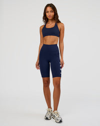 Woman wearing Rep Ultra High-Rise 9" Short Pockets - Future Navy-White | Model:Dakota | Size:S