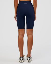 Woman wearing Rep Ultra High-Rise 9" Short Pockets - Future Navy-White | Model:Dakota | Size:S