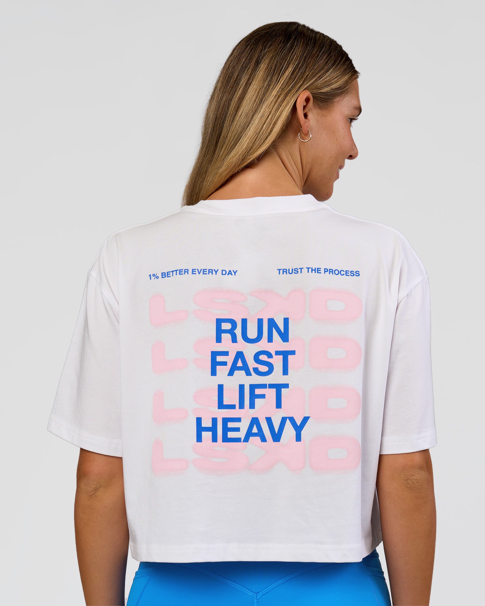Woman wearing Run Fast Lift Heavy FLXCotton Cropped Tee - White | Model:Amity | Size:S