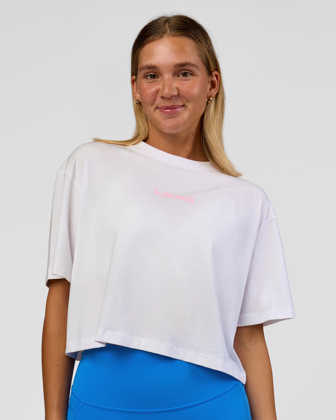 Woman wearing Run Fast Lift Heavy FLXCotton Cropped Tee - White | Model:Amity | Size:S