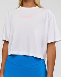 Woman wearing Run Fast Lift Heavy FLXCotton Cropped Tee - White | Model:Amity | Size:S