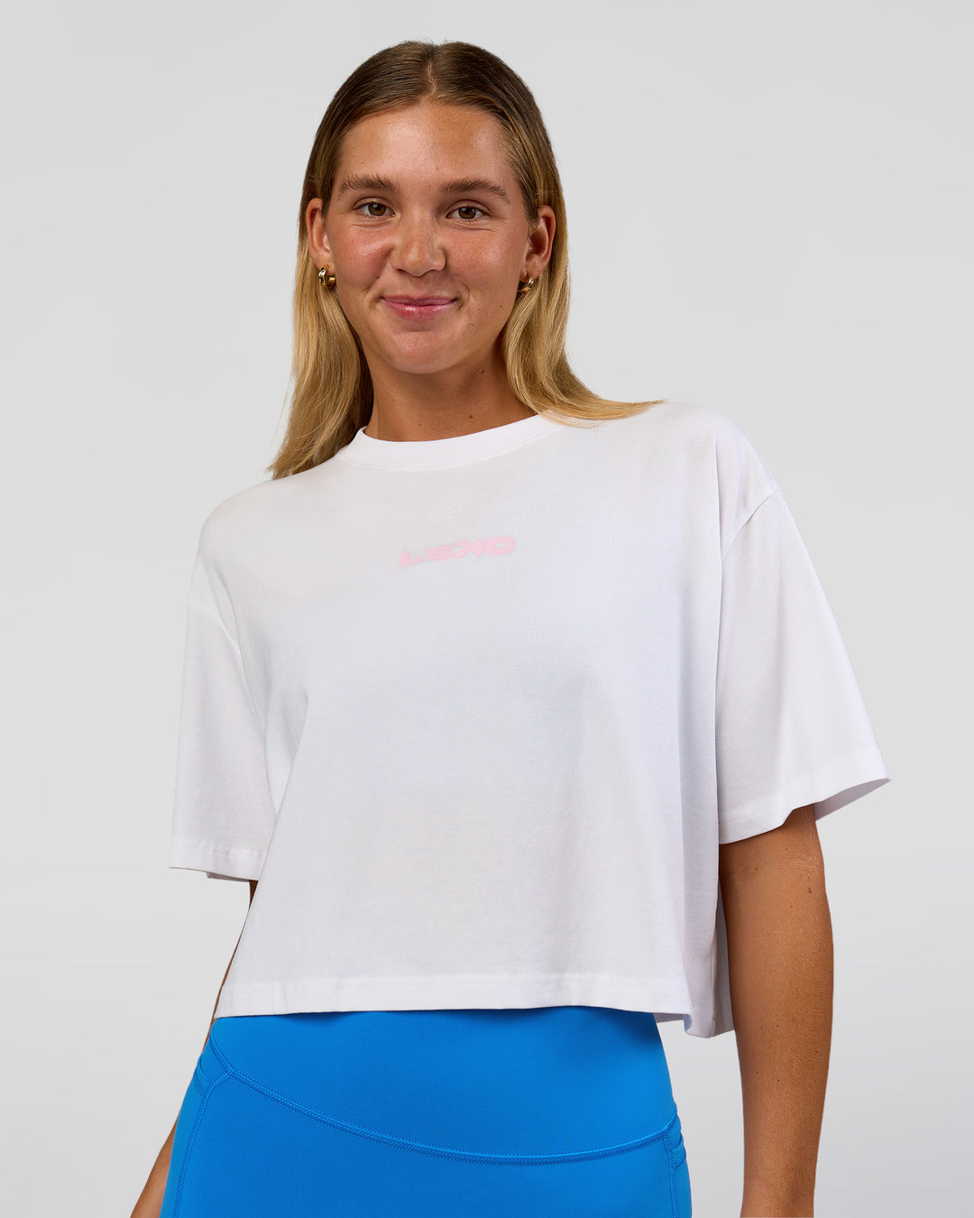 Woman wearing Run Fast Lift Heavy FLXCotton Cropped Tee - White | Model:Amity | Size:S