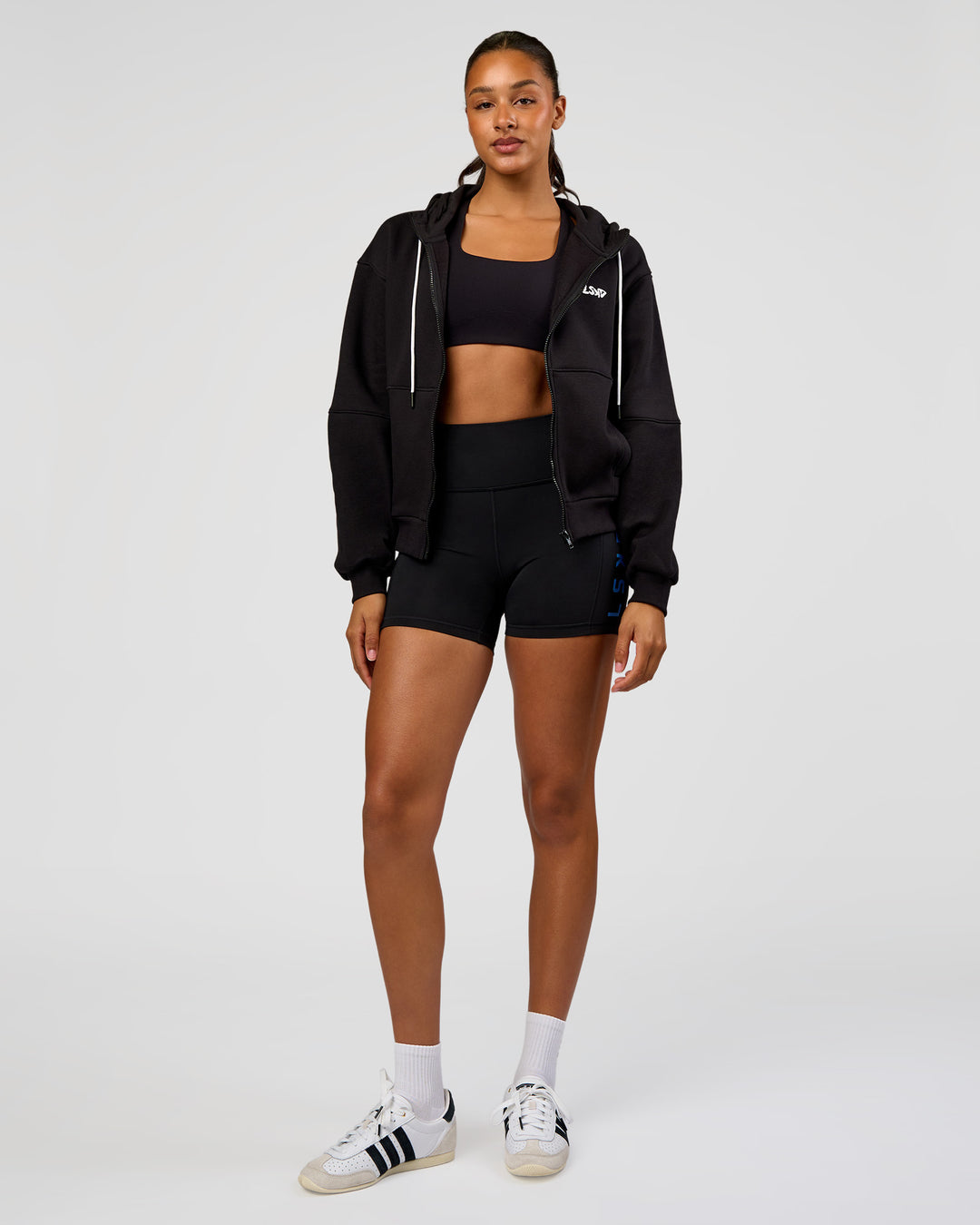 Woman wearing Run Fast Lift Heavy Hoodie - Black-White | Model:Rosie | Size:S